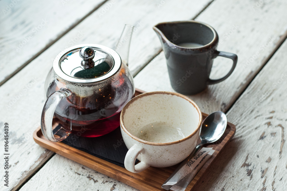 cup of tea with teapot and milk cup of tea with teapot and milk