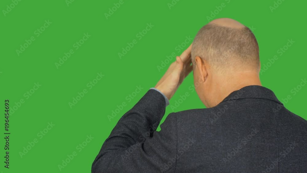 Bald man knocking hand on forehead back view on green background. Alpha channel, keyed green screen. Bald man knocking hand on forehead back view on green background. Alpha channel, keyed green screen.