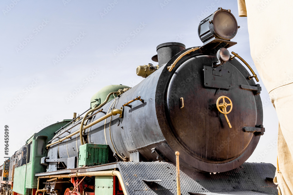 Naklejka premium Steam locomotive, still in use, in the desert of Wadi Rum, Jordan