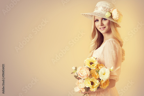 Beauty Model in Fashion Broad Brim Hat, Peony Flowers, Beautiful Woman Retro Portrait on Beige Background