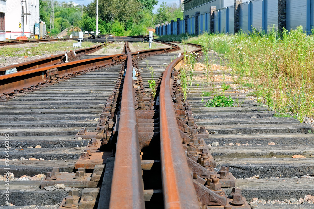 Rusty rails of the abandoned railroad.