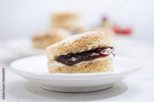 Close-up Scones with butter and strawberry jam