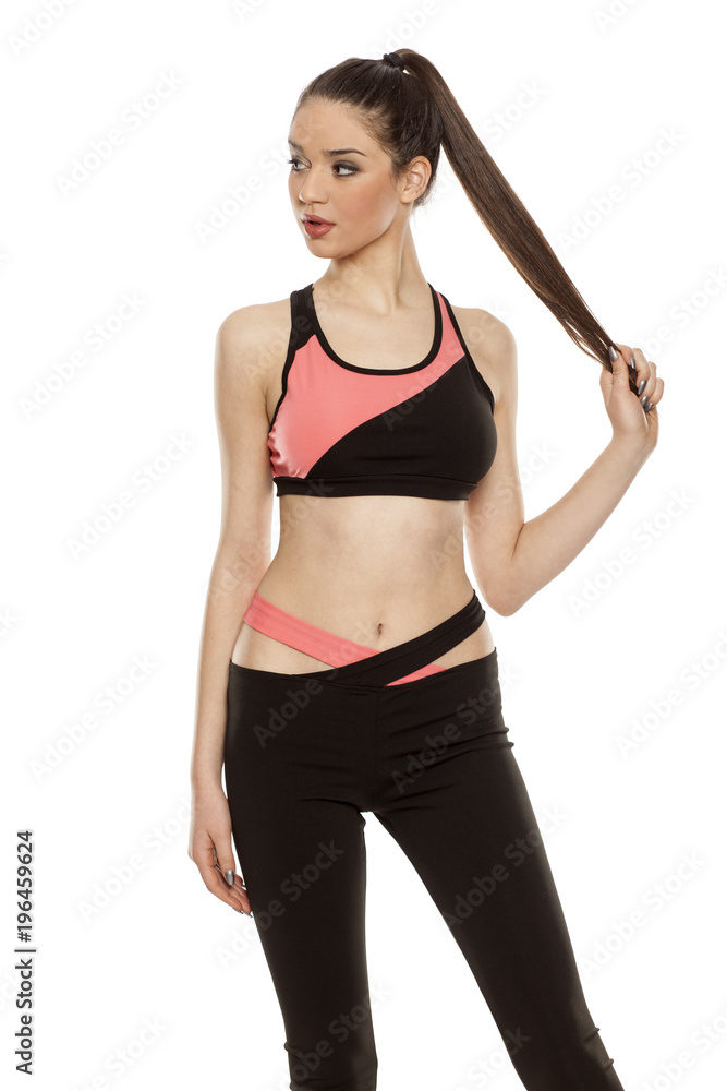 young woman in sportswear on white background young woman in sportswear on white background
