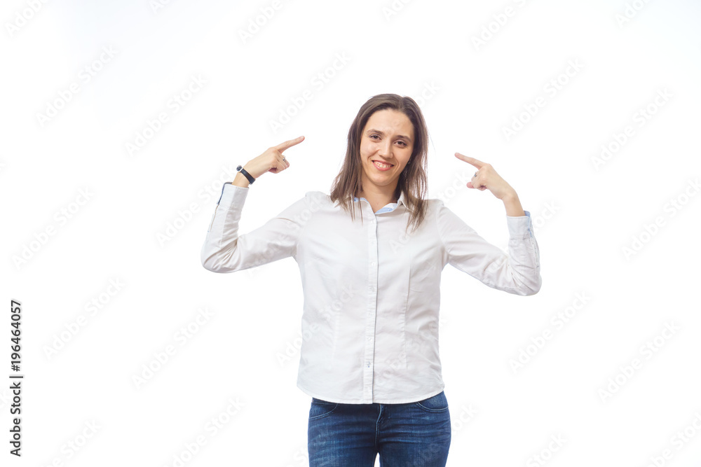 beautiful woman showing a finger at something, on a white background in the studio beautiful woman showing a finger at something, on a white background in the studio