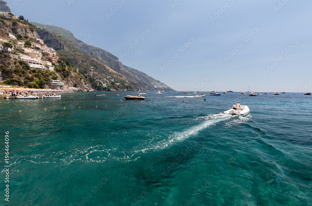  Fast boat on blue sea in Positano. Positano is a small town in Campania, southern Italy..