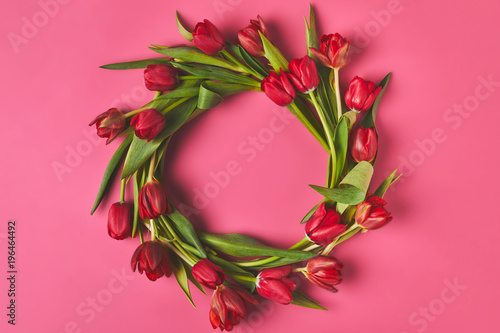 top view of wreath made of red tulips on pink, mothers day concept