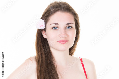 Beautiful young woman on white background with flower in head