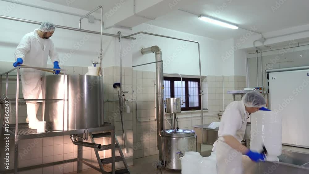 Diary cheese factory : operator working in the factory Diary cheese factory : operator working in the factory