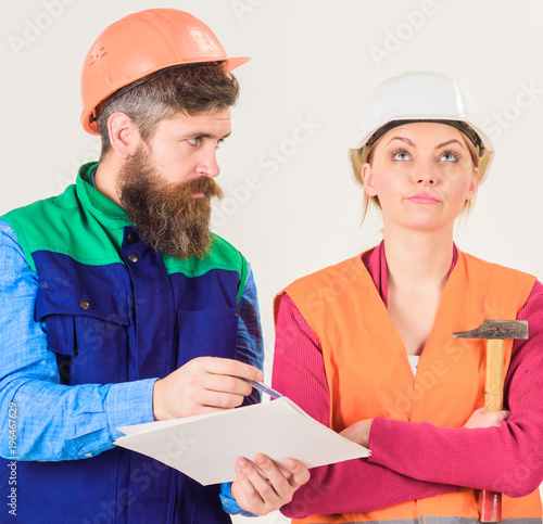 Insubordination concept. Man and woman in helmets