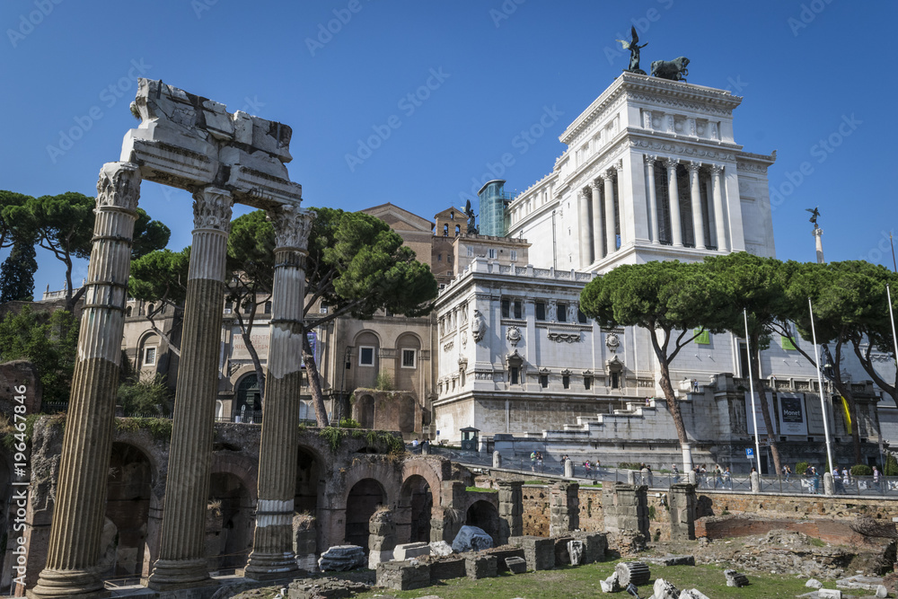 Roman Forum ruins in Rome, Italy.  The Roman Forum is a rectangular forum surrounded by the ruins of several important ancient government buildings at the center of the city of Rome. 