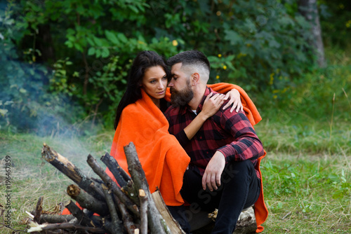 Young couple with calm faces have rest after hiking