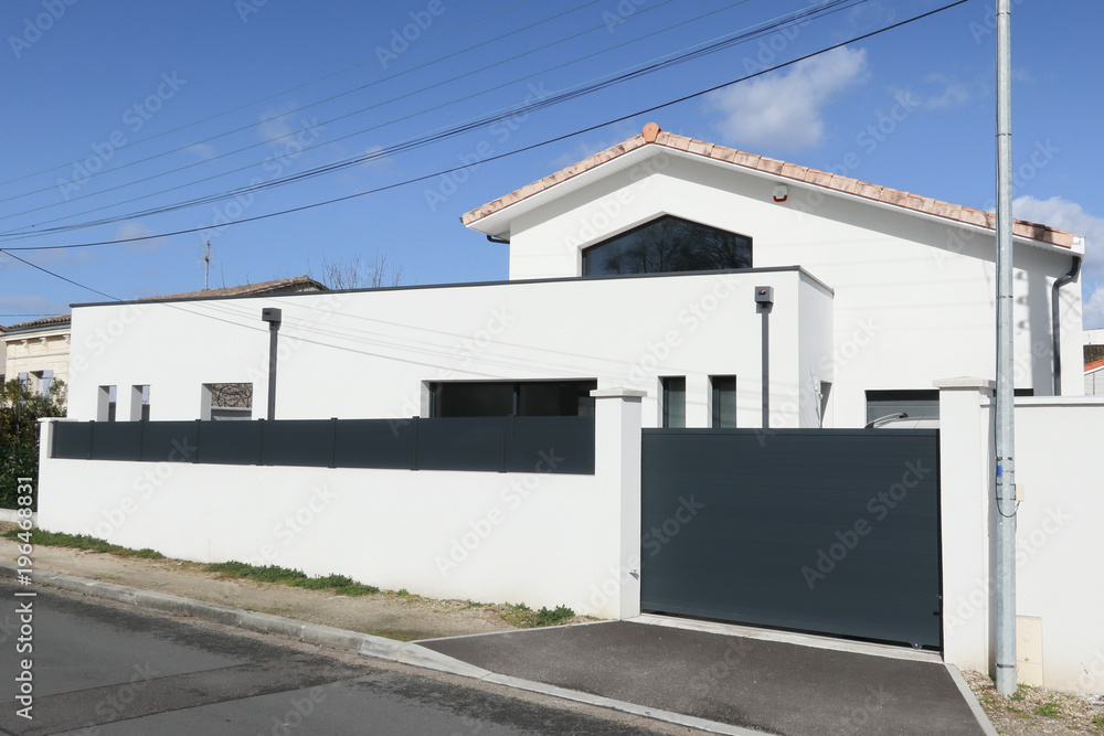 Facade and entry to a contemporary white rendered home Facade and entry to a contemporary white rendered home