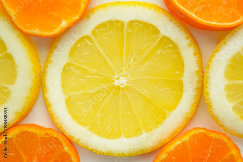 Background from slices of lemons and mandarin