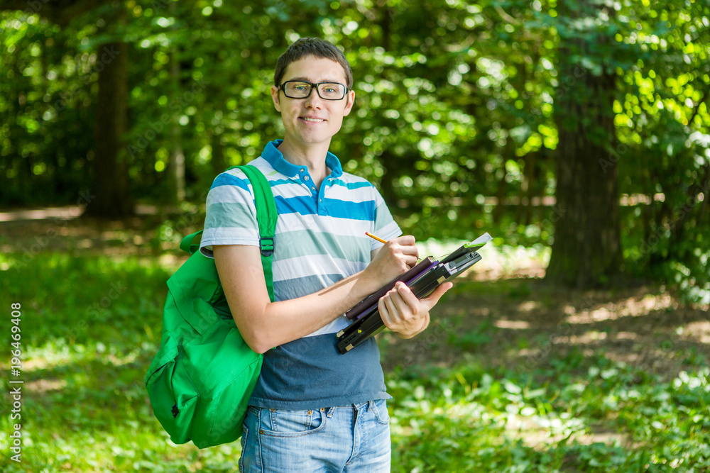 Obraz premium Image of a man with pencil in hand, wearing glasses