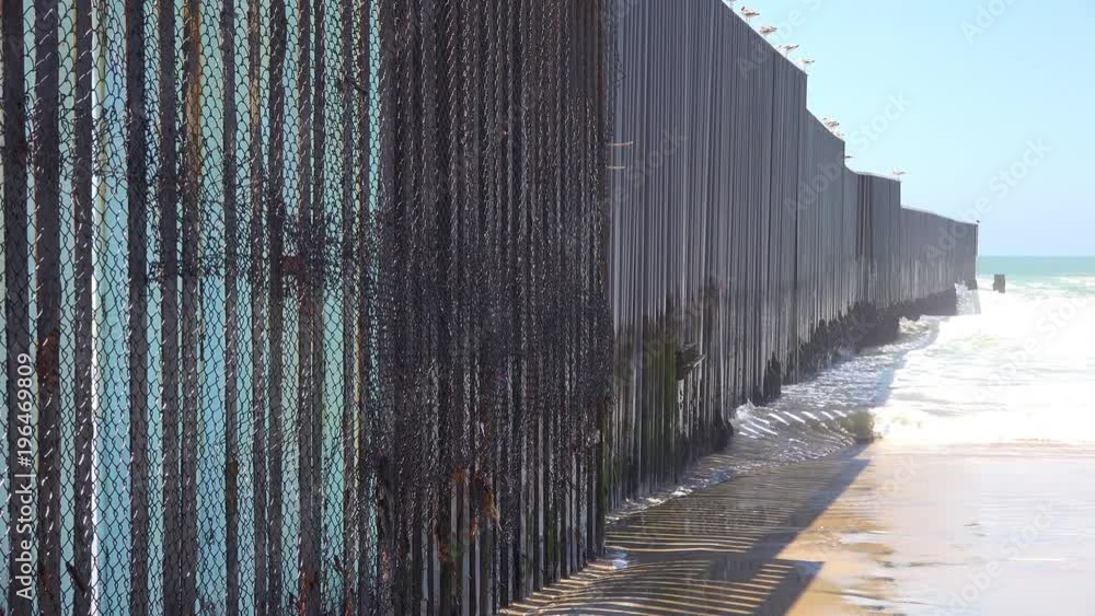 Waves roll into the beach at the U.S. Mexico border fence in the Pacific Ocean between San Diego and Tijuana. Waves roll into the beach at the U.S. Mexico border fence in the Pacific Ocean between San Diego and Tijuana.