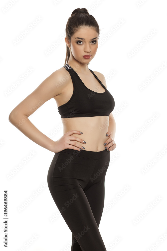 young woman in sportswear on white background young woman in sportswear on white background