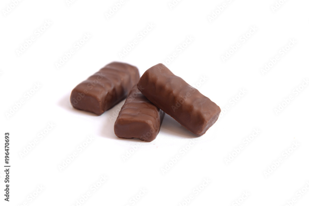 Three chocolate candies on a white background Three chocolate candies on a white background