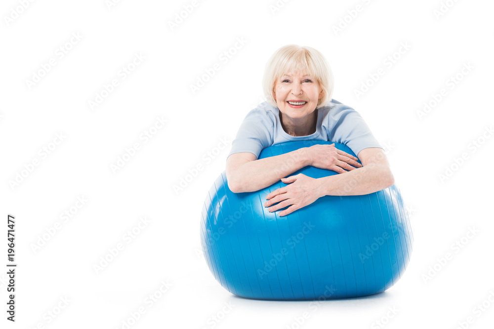 Portrait of smiling senior sportswoman with fitness ball isolated on white Portrait of smiling senior sportswoman with fitness ball isolated on white