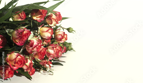 A bouquet of roses, yellow and red on a white background
