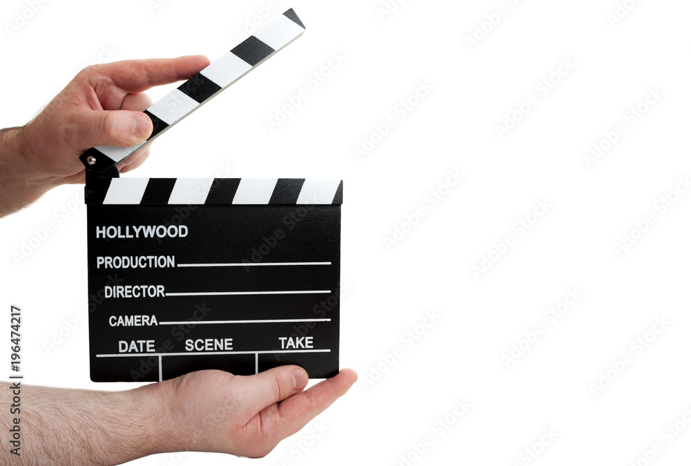 Hollywood movie production and vintage cinematography concept with a man holding a clapboard and waiting for the film director to call 