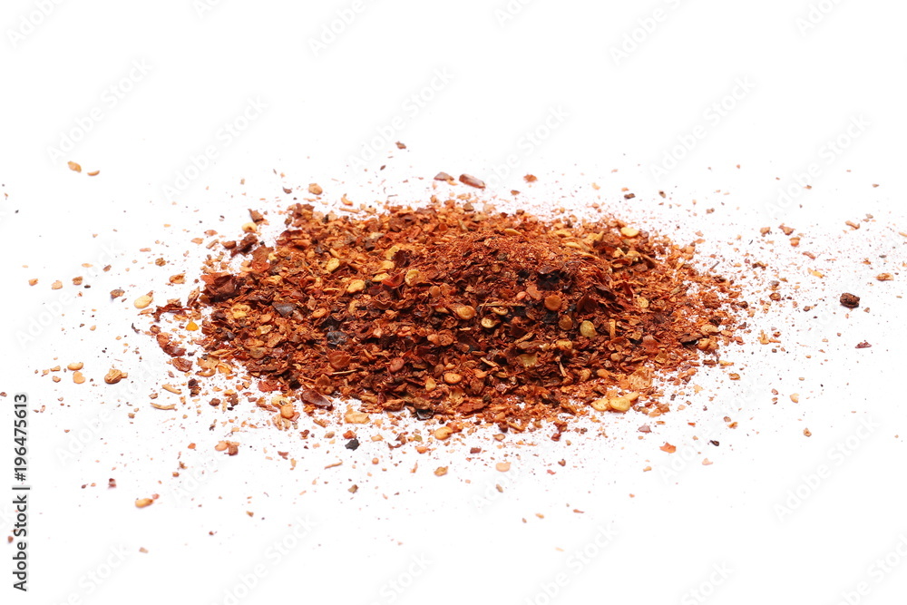 Crushed red cayenne pepper, dried chili flakes and seeds pile isolated on white background Crushed red cayenne pepper, dried chili flakes and seeds pile isolated on white background