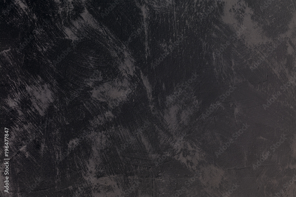 Naklejka premium Vintage dark textured putty on wall. Rough grunge wall background.