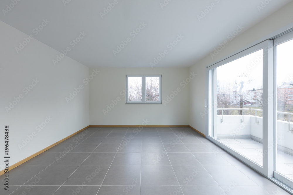 Empty room with large window on the balcony, empty space Empty room with large window on the balcony, empty space