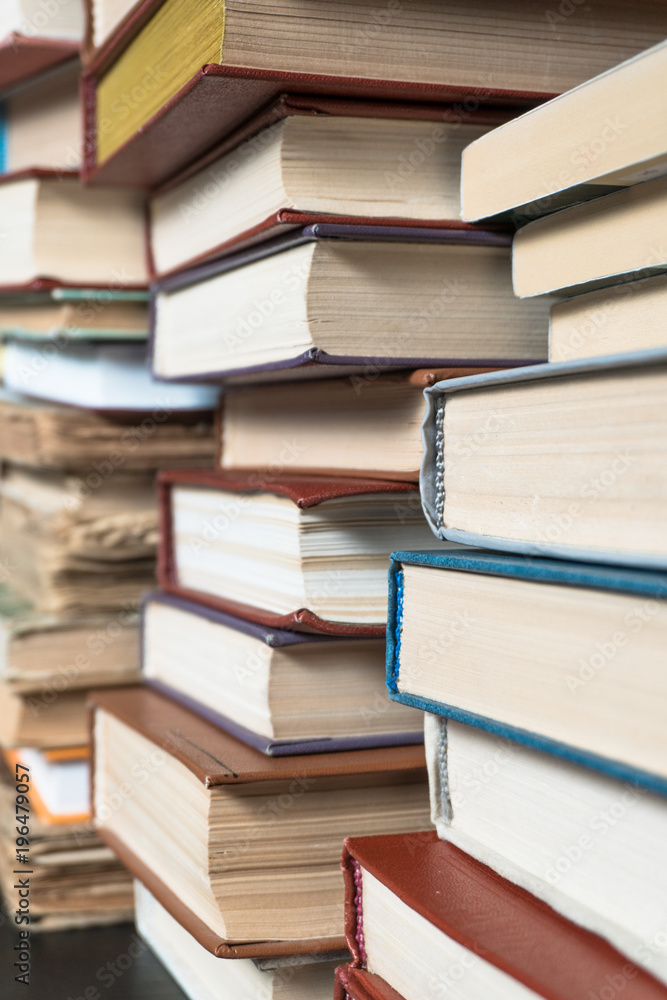 Many books in a bookstore or library on wooden background with copy space Many books in a bookstore or library on wooden background with copy space