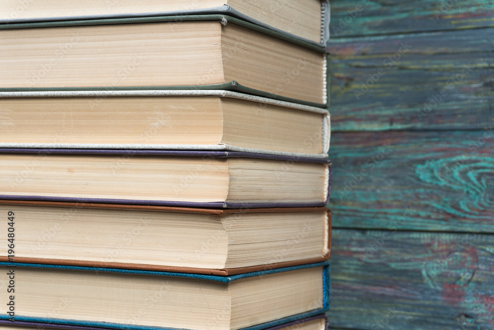 Stack books on wooden background. Back to school with copy space. Stack books on wooden background. Back to school with copy space.