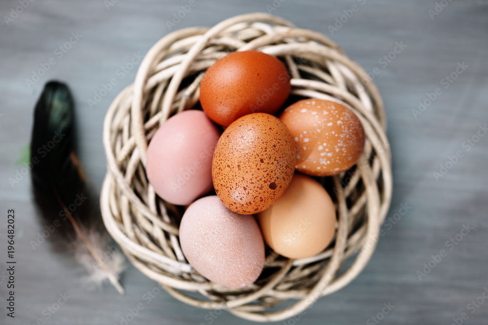 Beautiful raw eggs in basket, top view Beautiful raw eggs in basket, top view