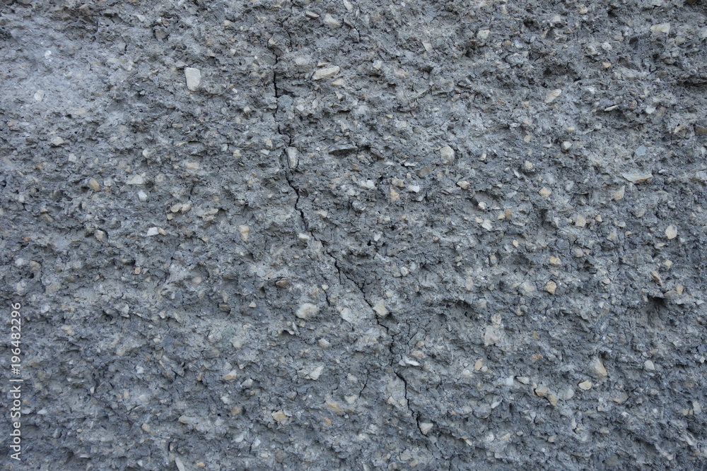 The image of the wall, plastered small stone for use as a background. The image of the wall, plastered small stone for use as a background.