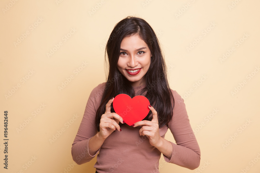 Asian woman with red heart. Asian woman with red heart.