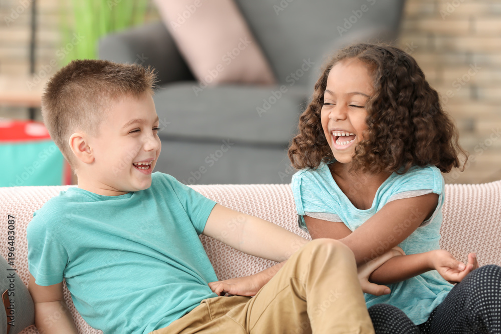 Fototapeta premium Cute children playing indoors. Child adoption