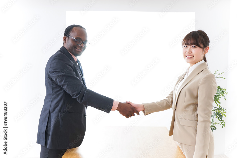 Businesspersons shaking hands