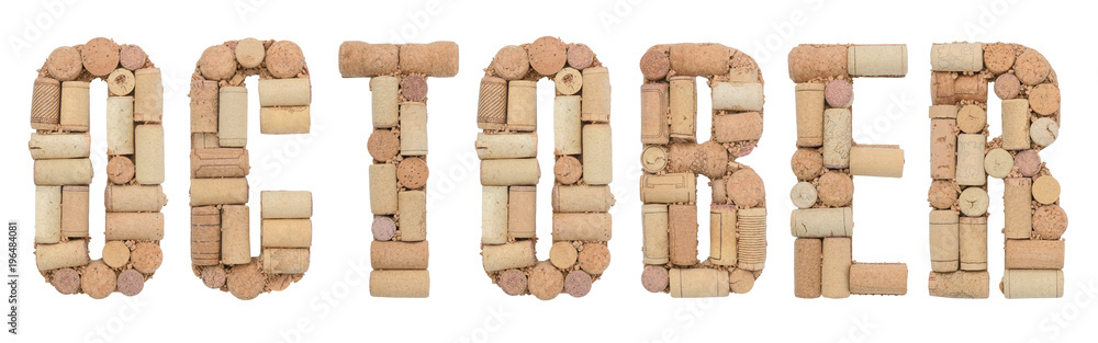 Word October made of wine corks Isolated on white background