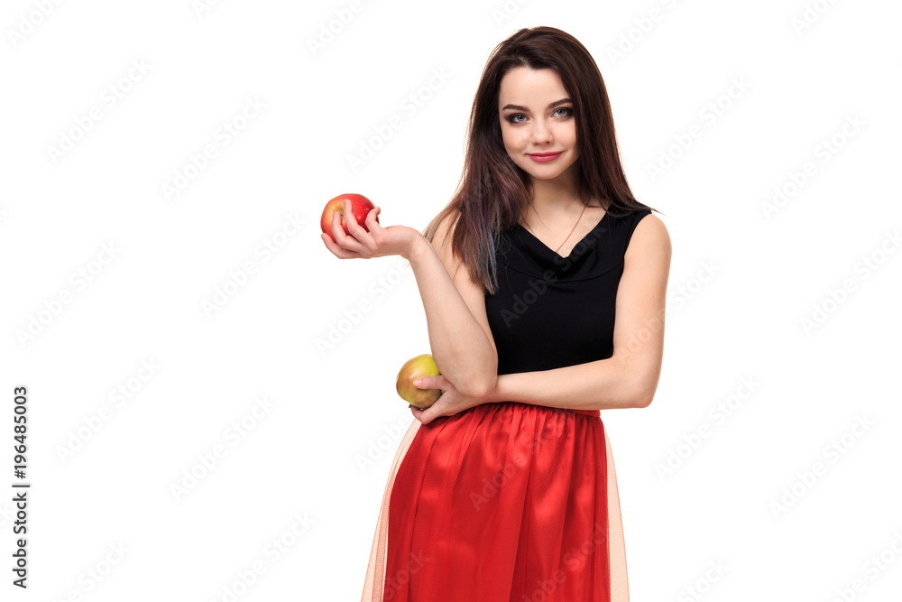 Beautiful young smiling woman holding an apple in her hands on a white background isolation Beautiful young smiling woman holding an apple in her hands on a white background isolation