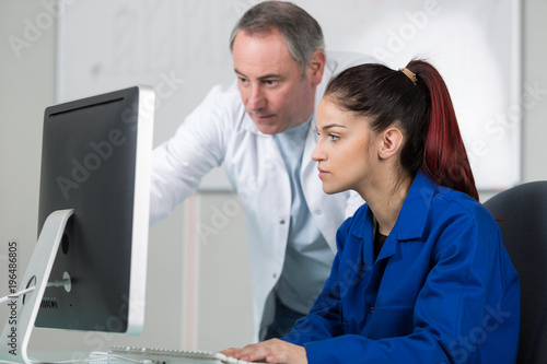 pretty young woman learning how to use computer