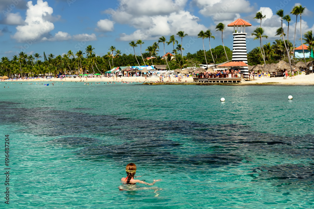Relaxing tourist swimming on the Dominicus beach on Dominican Republic