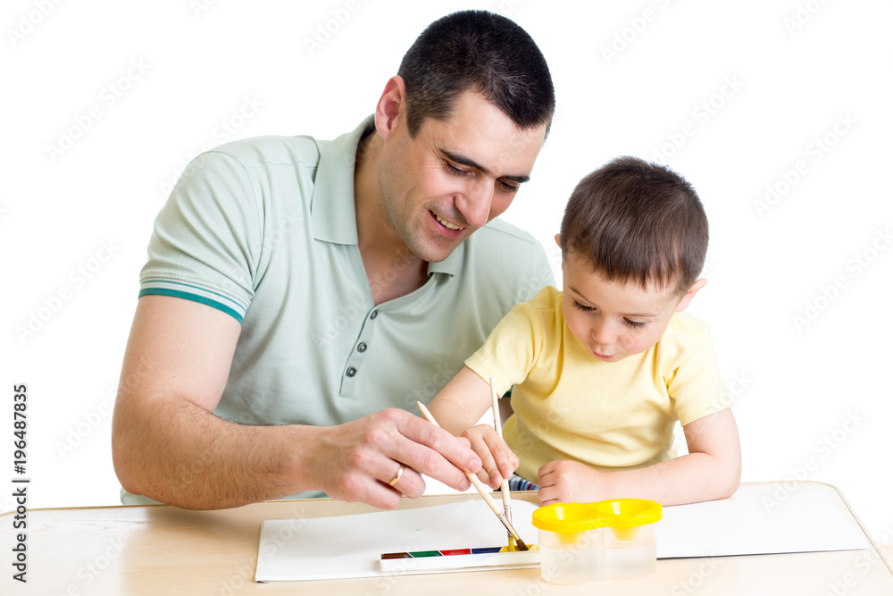 Father and kid son playing with paint colors Father and kid son playing with paint colors