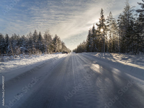 Winter landscape.Empty road covered with ice.   © tommitt