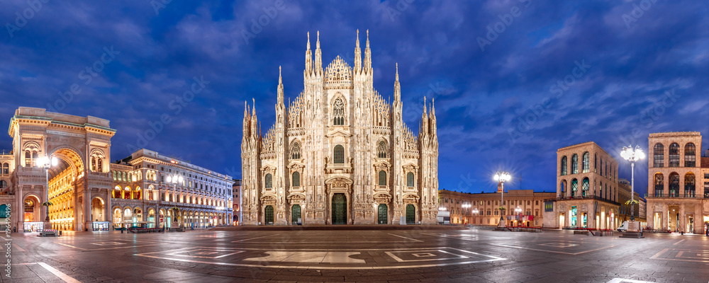 Panoramic view of piazza del Duomo, Cathedral Square, with Milan Cathedral or Duomo di Milano, Galleria Vittorio Emanuele II and Arengario, during morning blue hour, Milan, Lombardia, Italy