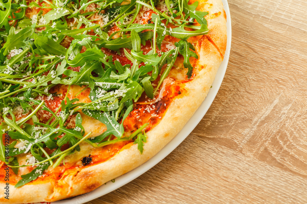 Pizza close up on a wooden table Pizza close up on a wooden table