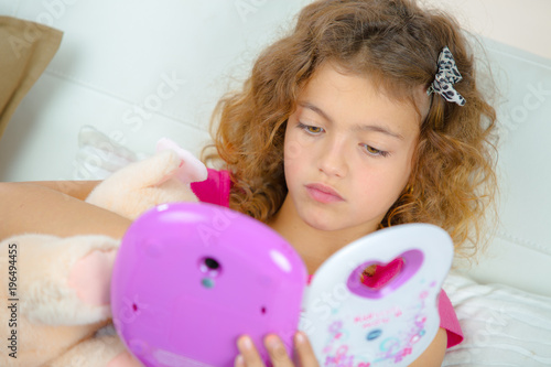 girl playing with electronic toy