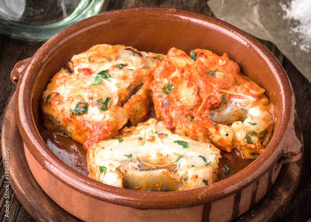 Homemade stew of hake wheels cooked in tomato sauce Homemade stew of hake wheels cooked in tomato sauce