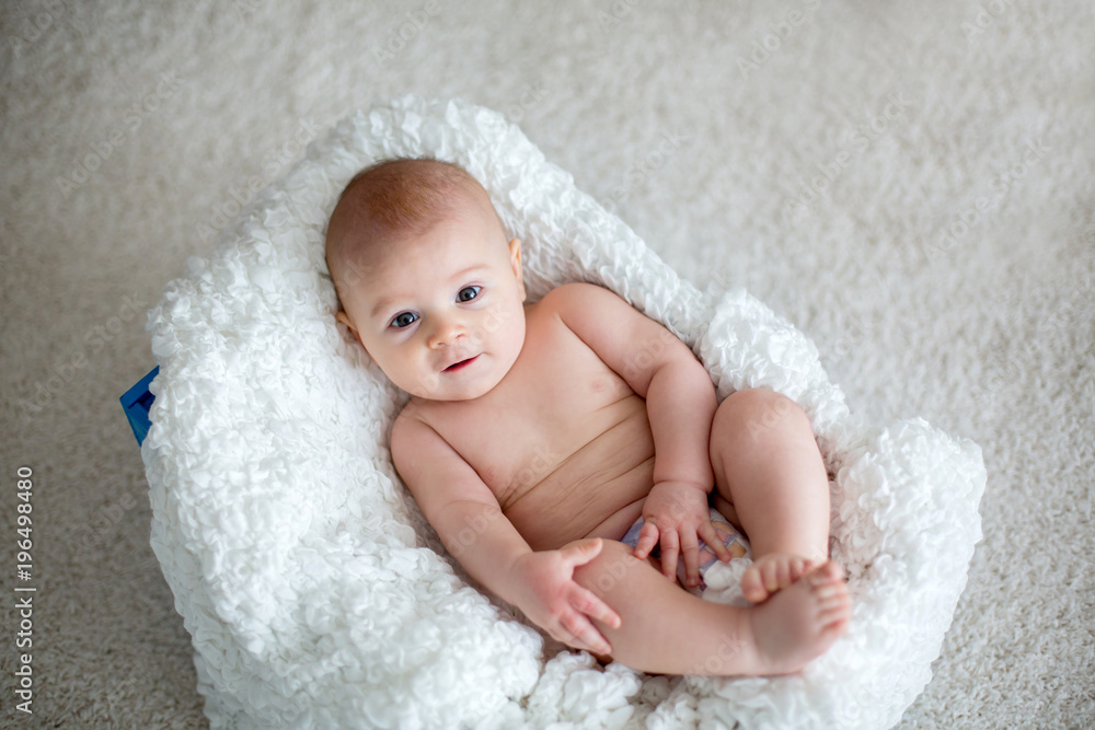 Little baby boy playing at home with soft teddy bear toys Little baby boy playing at home with soft teddy bear toys