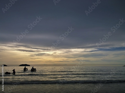 Elephants bathing in the ocean during sunset. Koh Chang island , Thailand