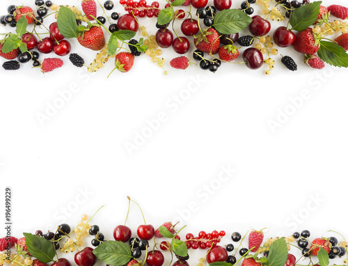 Black and red berries isolated on white. Ripe Mulberry, currants, cherries and strawberries on white background. Top view.