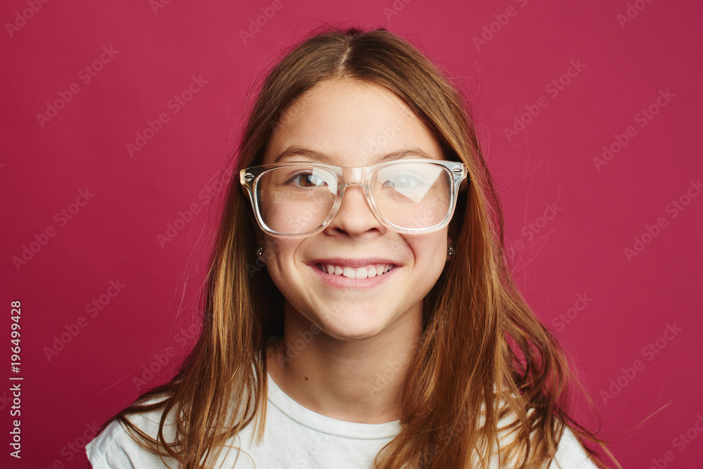 Portrait of brown-haired girl on pink background Portrait of brown-haired girl on pink background