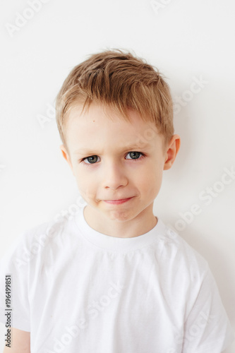 Portrait of little boy on white background