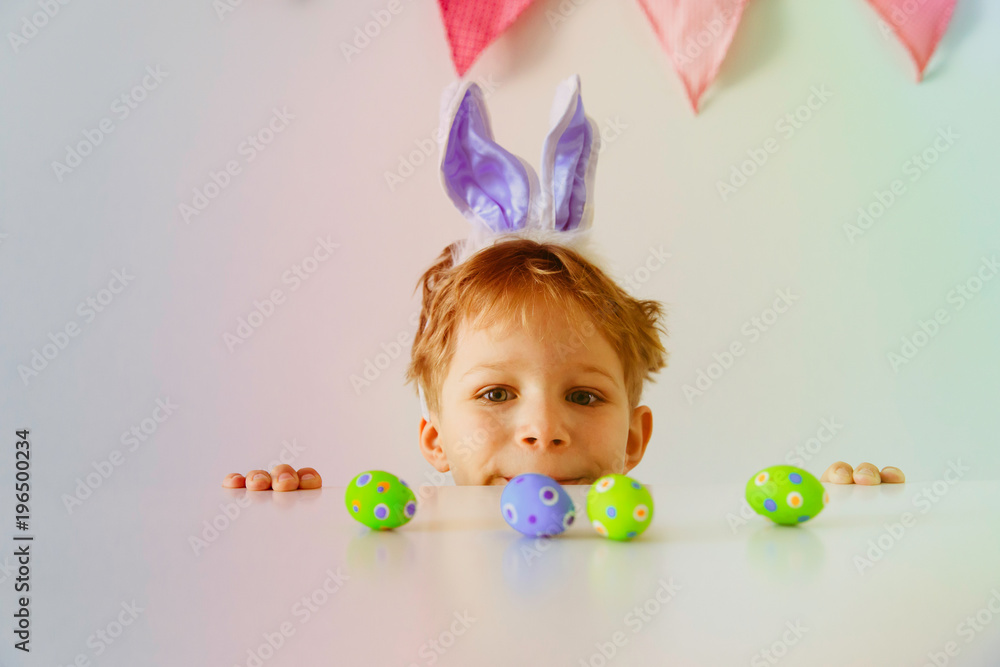 happy little boy play with eggs for easter happy little boy play with eggs for easter